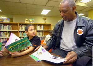 ManReadingWIthChildAP1
