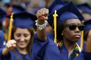 Graduates stand for anthem Lift Every Voice and Sing during 2014 commencement ceremonies at Howard University in Washington