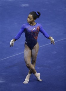 Gabby Douglas performs on the floor exercise at the U.S. women's gymnastic championships Thursday, Aug. 13, 2015, in Indianapolis. (AP Photo/Darron Cummings)