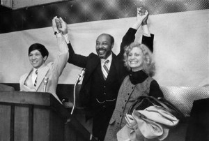 In this November 1977, file photo, Dennis Kucinich, his wife, Sandy, right, and Rep. Louis Stokes, D-Ohio, raise their arms at the Party Center in Cleveland. Stokes, a 15-term Ohio congressman who took on tough assignments looking into assassinations and scandals, died late Tuesday, Aug. 18, 2015. Stokes was 90. (The Plain Dealer via AP, File) MANDATORY CREDIT; NO SALES