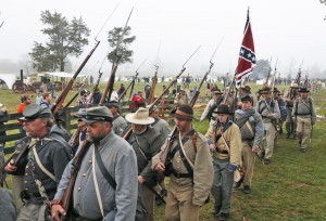 Confederate re-enactors march back to camp after a re-enactment of the Battle of Appomattox Court House as part of  the commemoration of the 150th anniversary of the surrender of the Army of Northern Virginia at Appomattox Court House in Appomattox, Va., Thursday, April 9, 2015.  The battle was the final battle of the army of Confederate General Robert E. Lee before his surrender to Union troops.  (AP Photo/Steve Helber) ORG XMIT: VASH116