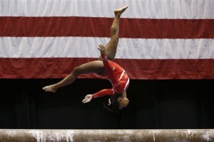 Simone Biles competes on the balance beam at the U.S. women's gymnastic championships Saturday, Aug. 15, 2015, in Indianapolis. Bliles won the balance beam portion of the competition. (AP Photo/AJ Mast)