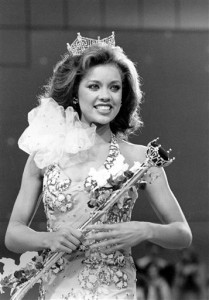In this Sept. 17, 1983 file photo, Miss New York Vanessa Williams appears during her coronation walk after she was crowned Miss America 1984 at the Miss America Pageant in Atlantic City, N.J. The Miss America Organization, Dick Clark Productions and the ABC television network announced Tuesday, Sept. 8, 2015, that they are bringing back the actress and singer to serve as head judge for the 2016 competition. Williams won the title in 1984 but resigned after Penthouse magazine published sexually explicit photographs of her taken several years earlier.   (AP Photo/Jack Kanthal, File)