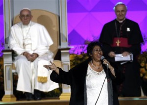 Aretha Franklin performs as Pope Francis is seated nearby during the Festival of Families, Saturday, Sept. 26, 2015, in Philadelphia. (AP Photo/Matt Slocum)