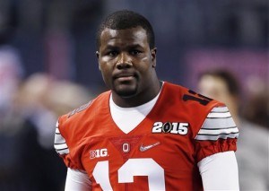 FILE - In this Jan. 12 2015, file photo, Ohio State's Cardale Jones warms up for the NCAA college football playoff championship game against Oregon in Arlington, Texas. Jones was taken to the hospital Wednesday night, Sept. 2, because of a headache, his mother told The Toledo Blade. Florence Jones told the newspaper her son was taken to an emergency room in Columbus, Ohio, and that he should be fine. (AP Photo/Brandon Wade, File)