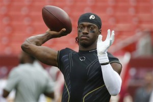 Washington Redskins quarterback Robert Griffin III (10) warms up before an NFL football game against the Detroit Lions in Landover, Md., Thursday, Aug. 20, 2015. (AP Photo/Alex Brandon)