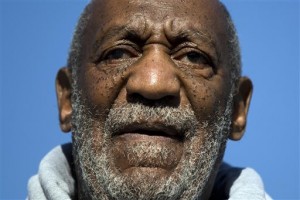 In this Nov. 11, 2014, file photo, comedian and Navy veteran Bill Cosby speaks during a Veterans Day ceremony in Philadelphia. Cosby is seeking to hire a criminal defence lawyer as prosecutors near Philadelphia revisit a 2005 sexual-assault complaint. Lawyer Edwin Jacobs says Cosby's agents contacted him in the last few days about a Montgomery County investigation and he referred them to another Philadelphia-area lawyer. The Philadelphia Inquirer first reported Tuesday on Jacobs' involvement.  (AP Photo/Matt Rourke, File)