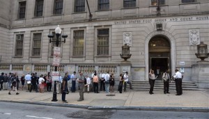 Members of the media stand in line to enter the Baltimore Circuit Court, as the first court hearing was set to begin in the case of six police officers criminally charged in the death of Freddie Gray, on Wednesday, Sept. 2, 2015 in Baltimore.  Six police officers face charges that range from second-degree assault, a misdemeanor, to second-degree "depraved-heart" murder.   (Kim Hairston/The Baltimore Sun via AP)  WASHINGTON EXAMINER OUT; MANDATORY CREDIT