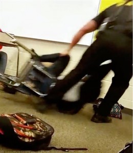 In this Monday, Oct. 26, 2015 photo made from video taken by a Spring Valley High School student, Senior Deputy Ben Fields drags a student across the floor as he removes her from her chair after she refused to leave her high school math class, in Columbia S.C. The Justice Department opened a civil rights investigation Tuesday after Fields flipped the student backward in her desk and tossed her across the floor. (AP Photo)