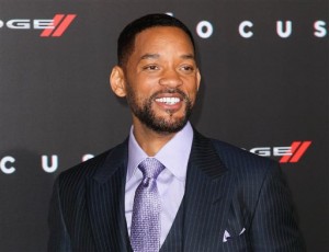 In this Feb. 24, 2015 file photo, Will Smith arrives at the world premiere of "Focus" in Los Angeles. The Grammy-winning rapper and Oscar-nominated actor appears on a remix to Colombian band Bomba Estereos song, Fiesta. The remix was released digitally Friday, Oct. 2. The collaboration marks Smiths return to music since his 2005 album, Lost and Found. Smith discovered Bomba Estereo, known for its blend of Latin, tropical and electro sounds, on a recent trip to Colombia. He then asked the group to collaborate. (Photo by John Salangsang/Invision/AP, File)