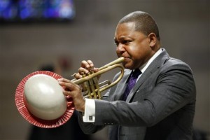 In this Sept. 20, 2014, file photo, musician Wynton Marsalis performs during a memorial service for actress Ruby Dee at The Riverside Church in New York. Marsalis was honored with The Marian Anderson Award in Philadelphia on Tuesday, Nov. 10, 2015. Marsalis, who has won nine Grammys and is the first jazz musician to win a Pulitzer Prize for music, was selected for his work on and off the stage. His humanitarian work includes The Children's Defense Fund and helping victims of Hurricane Katrina. He's also the director of Jazz at Lincoln Center. (AP Photo/Jason DeCrow, File)