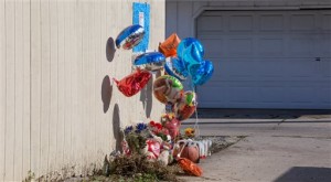 A makeshift memorial sits Wednesday, Nov. 4, 2015 where Tyshawn Lee was fatally shot in Chicago. Lee, 9, was shot Monday in the Auburn Gresham neighborhood. (AP Photo/Teresa Crawford)