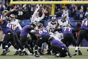 Baltimore Ravens kicker Justin Tucker (9) kicks the game winning field goal as St. Louis Rams defensive back Cody Davis (38) leaps in a failed attempt to block it during the second half of an NFL football game in Baltimore, Sunday, Nov. 22, 2015. The Ravens defeated the Rams 16-13. (AP Photo/Patrick Semansky)