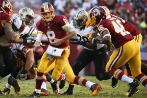 Washington Redskins quarterback Kirk Cousins (8) turns out of the pocket during the second half of an NFL football game against the New Orleans Saints in Landover, Md., Sunday, Nov. 15, 2015. (AP Photo/Evan Vucci)