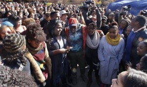In this Monday, Nov. 9, 2015, file photo, supporters gather after the announcement that University of Missouri System President Tim Wolfe would resign, in Columbia, Mo., over mounting pressure from campus groups regarding his handling of racial tensions at the school. Payton Head, the gay, black president of the Missouri Students Association, said former administrators gave the impression discrimination is tolerated at the university and that allowed racist acts to keep occurring. (Matt Hellman/Missourian via AP, File) MANDATORY CREDIT