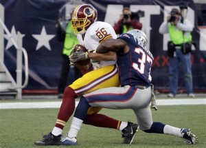 Washington Redskins tight end Jordan Reed (86) catches a touchdown pass as New England Patriots defensive back Jordan Richards (37) wraps him up in the end zone during the second half of an NFL football game, Sunday, Nov. 8, 2015, in Foxborough, Mass. (AP Photo/Steven Senne)