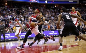 Washington Wizards guard Bradley Beal (3) goes up for a dunk in the second half of an NBA basketball game against the San Antonio Spurs, Wednesday, Nov. 4, 2015, in Washington. The Wizards won 102-99.  (AP Photo/Alex Brandon)