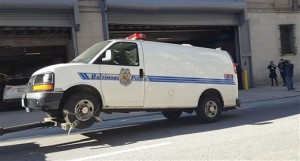 FILE - In this Dec. 3, 2015 photo, the Baltimore police van Freddie Gray was transported in the day of his arrest and injury is moved into a courthouse garage before being shown to jurors in the trial of officer William Porter in Baltimore. In Porters case, an officers negligence, rather than violent acts or excessive force, is on trial. He is also charged with assault, reckless endangerment and misconduct in office. If convicted, Porter faces up to 25 years in prison. Legal experts say when its inaction rather than action thats in question, it could be a hard case to prove. (Ian Duncan/The Baltimore Sun via AP, File)  WASHINGTON EXAMINER OUT; MANDATORY CREDIT