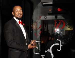 This Nov. 29, 2013 file photo shows, Jayceon Terrell Taylor aka The Game, at his Private Black Friday Birthday Dinner at Philippe in Beverly Hills, Calif. Taylor, pleaded not guilty on Monday, Dec. 21, 2015, to charges that he punched and threatened an off-duty Los Angeles police officer during a pickup basketball game in March. (Photo by Arnold Turner/Invision/AP, File)
