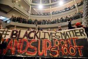 In this Dec. 20, 2014 file photo, demonstrators chant, "Black lives matter," to protest police, at the Mall of America rotunda in Bloomington, Minn. The Minneapolis chapter of Black Lives Matter is planning to rally later in December 2015 at the mall to protest the November killing of Jamar Clark, a black man by Minneapolis police. (Aaron Lavinsky/Star Tribune via AP) MANDATORY CREDIT
