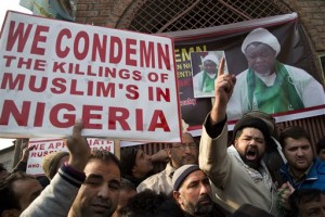 A Kashmiri Shiite leader, second from right, wearing black cap, shout slogans against the Nigerian government detaining their leader Ibraheem Zakzaky in Nigeria, in Srinagar, Indian-controlled Kashmir, Friday, Dec. 18, 2015. Nigerian Soldiers killed hundreds of Shiite Muslims this weekend after their group opened fire on the convoy of Nigeria's army chief, the Shia Islamic Movement and military reports said Monday. (AP Photo/Dar Yasin)
