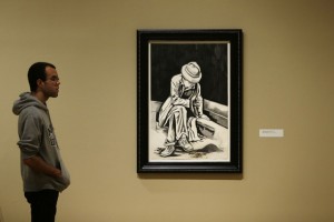 A man views work in the exhibit titled, "Procession: The Art of Norman Lewis," Wednesday, Dec. 2, 2015, at the Pennsylvania Academy of the Fine Arts in Philadelphia. Lewis was the first major African-American abstract expressionist. The show is scheduled to run through April 3, 2016. (AP Photo/Matt Rourke)