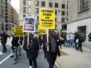 A demonstrators protest outside of the courthouse after a mistrial was declared in the manslaughter trial of Officer William Porter, one of six Baltimore city police officers charged in connection to the death of Freddie Gray, on Wednesday, Dec. 16, 2015, in Baltimore Md. (AP Photo/Jose Luis Magana)