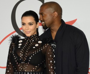 In this Monday, June 1, 2015, file photo, Kim Kardashian, left, and Kanye West arrive at the 2015 CFDA Fashion Awards at Alice Tully Hall, Lincoln Center, in New York. Kim Kardashian West and husband Kanye West welcomed a baby boy early Saturday, Dec. 5, 2015, in Los Angeles. This is the second child for the superstar couple: Daughter North was born in 2013. (Photo by Evan Agostini/Invision/AP, File)