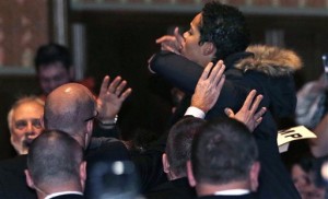 A protestor yells as security tries to escort her out of the audience during an address by Republican presidential candidate Donald Trump at a campaign stop at the Flynn Center of the Performing Arts in Burlington, Vt., Thursday, Jan. 7, 2016. (AP Photo/Charles Krupa)