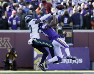 Seattle Seahawks cornerback Jeremy Lane (20) breaks up a pass intended for Minnesota Vikings wide receiver Stefon Diggs (14) during the second half of an NFL wild-card football game, Sunday, Jan. 10, 2016, in Minneapolis. The Seahawks won 10-9. (AP Photo/Nam Y. Huh)