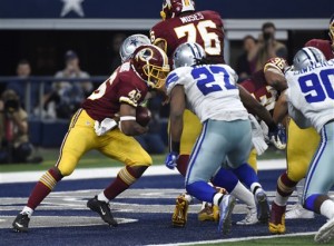 Washington Redskins running back Alfred Morris (46) is unable to break out of the end zone as Dallas Cowboys' J.J. Wilcox (27) and Demarcus Lawrence (90) help tackle Morris for a safety in the second half of an NFL football game, Sunday, Jan. 3, 2016, in Arlington, Texas. (AP Photo/Michael Ainsworth)