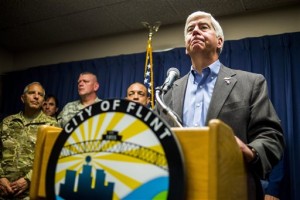 Gov. Rick Snyder speaks about the Flint water crisis during a press conference on Wednesday, Jan. 27, 2016, at City Hall in downtown, Flint, Mich. Environmental and civil rights groups want a federal judge to order the prompt replacement of all lead pipes in Flint's water system to ensure that residents have a safe drinking supply, a demand that Snyder said on Wednesday might be a long-term option but not an immediate one. (Jake May /The Flint Journal-MLive.com via AP) LOCAL TELEVISION OUT; LOCAL INTERNET OUT; MANDATORY CREDIT