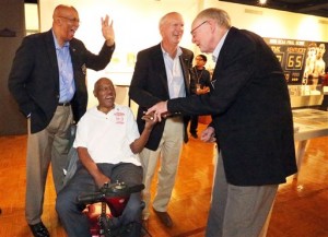 Members of the 1966 Texas Western College basketball championship team laugh together at a special exhibit on the team in the Union building on the UTEP campus in El Paso, Texas, Thursday, Feb. 4, 2016. They are from left: Nevil Shed, Willie Cager, Dick Myers and Louis Baudoin. Team members are in town for the 50th anniversary of the historic event. The game between Texas Western College and Kentucky was played on March 19, 1966. (Rudy Gutierrez/The El Paso Times via AP)
