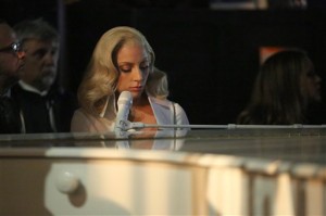 Lady Gaga is seen from backstage as she performs her nominated song "Til It Happens To You" at the Oscars on Sunday, Feb. 28, 2016, at the Dolby Theatre in Los Angeles. (Photo by Matt Sayles/Invision/AP)