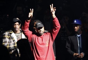 Kanye West gestures to the audience at the unveiling of the Yeezy collection and album release for his latest album, "The Life of Pablo," Thursday, Feb. 11, 2016 at Madison Square Garden in New York. (AP Photo/Bruce Barton)