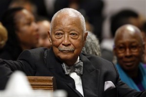 In this Sept. 20, 2014 file photo, former New York Mayor David Dinkins attends a memorial service for actress Ruby Dee at The Riverside Church in New York. The 88-year-old Dinkins told the New York Daily News on Friday, Feb. 19, 2016 that he was at New York Presbyterian Hospital being treated for a lung infection. (AP Photo/Jason DeCrow, File)