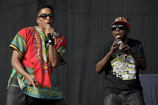 In this July 14, 2013 file photo, Q-Tip, left, and  Phife Dawg from U.S group A Tribe Called Quest performs on stage during the Wireless Festival at the Queen Elizabeth Olympic Park, in London. Dawg, a masterful lyricist whose witty wordplay was a linchpin of the groundbreaking hip-hop group, died Tuesday, March 22, 2016, from complications resulting from diabetes, his family said in a statement Wednesday. He was 45. (Photo by Jonathan Short/Invision/AP, File)