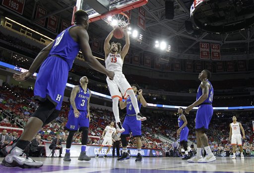 Virginia forward Anthony Gill (13) dunks the ball against Hampton during the second half of a first-round men's college basketball game in the NCAA Tournament, Thursday, March 17, 2016, in Raleigh, N.C. Virginia won 81-45. (AP Photo/Chuck Burton)
