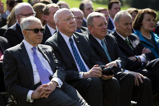 From left, Senate Minority Leader Sen. Harry Reid, D-Nev., Sen. Patrick Leahy, D-Vt., Sen. Dick Durbin, D-Ill., Sen. Chuck Schumer, D-N.Y., and Sen. Dianne Feinstein, D-Calif., watch as President Barack Obama nominates Federal appeals court judge Merrick Garland as his nominee for the Supreme Court during an announcement in the Rose Garden of the White House, on Wednesday, March 16, 2016, in Washington. (AP Photo/Evan Vucci)