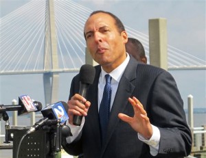 Atlanta businessman Michael Boulware Moore speaks to members of the media Friday, March 4, 2016, at the site of a planned $75 million International African American Museum in Charleston, S.C. Moore, the great-great grandson of the slave Robert Smalls who commandeered a Confederate steamship and sailed it to Union forces during the Civil War, was named Friday as the first president and CEO of the museum expected to open in the fall of 2018.  (AP Photo/Bruce Smith)