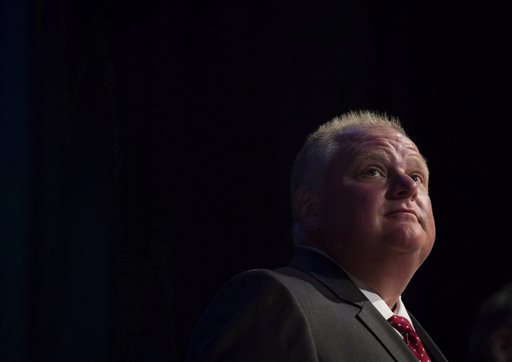 FILE - In this July 15, 2014 file photo, Mayor Rob Ford pauses while participating in a mayoral debate in Toronto. Ford, whose career crashed in a drug-driven, obscenity-laced debacle, died Tuesday, March 22, 2016 after fighting cancer, his family says. He was 46. (Darren Calabrese /The Canadian Press via AP) MANDATORY CREDIT
