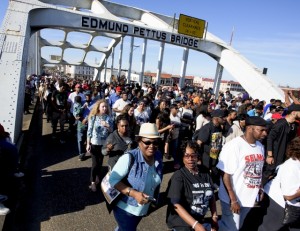 Thousands of marchers cross the bridge on the the 51st anniversary of the voting rights demonstration that came to be known as "Bloody Sunday," during the re-enactment of the march across the Edmund Pettus Bridge in Selma, Ala. on Sunday March 6, 2016. (Mickey Welsh/Montgomery Advertiser via AP)
