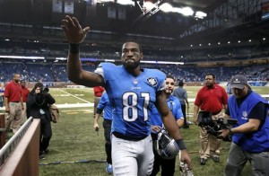In this Nov. 9, 2014, file photo, Detroit Lions wide receiver Calvin Johnson waves to fans after defeating the Miami Dolphins 20-16 in a NFL football game in Detroit. Calvin Johnson has retired. The 30-year-old receiver, known as Megatron, announced his decision Tuesday, March 8, 2016, to walk away from the NFL after nine mostly spectacular seasons with the Detroit Lions. (AP Photo/Paul Sancya, File)