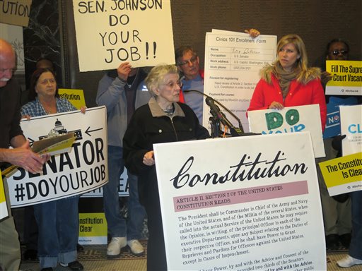 Speaker Ruth Schaaf, of Racine, Wisconsin, is among the dozens who rallied Monday, March 21, 2016, at Milwaukees City Hall to urge U.S. Sen. Ron Johnson to support confirmation hearings for U.S.Supreme Court nominee Merrick Garland in Milwaukee, Wis. The rally Monday inside Milwaukee's City Hall was among about 50 scheduled around the nation with the theme "Do your job!", which participants chanted several times. President Barack Obama recommended Garland to replace the late Justice Antonin Scalia, but Republicans have said they won't hold a hearing or vote in an election year.  (AP Photo/Greg Moore)