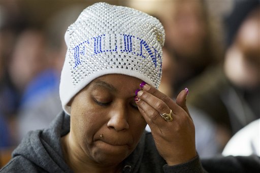 Nakiya Wakes, of Flint, Mich., attends a community forum as Democratic presidential candidate Sen. Bernie Sanders, I-Vt., listens to concerns from members of the Flint community about contaminated water at Woodside Church in Flint, Mich., Thursday, Feb. 25, 2016. Wakes miscarried twins last July before receiving notice that pregnant women should not drink the tap water in Flint and says her first grade son has been showing behavioral problems that she thinks are connected to the lead that has been found in the drinking water. (AP Photo/Jacquelyn Martin)