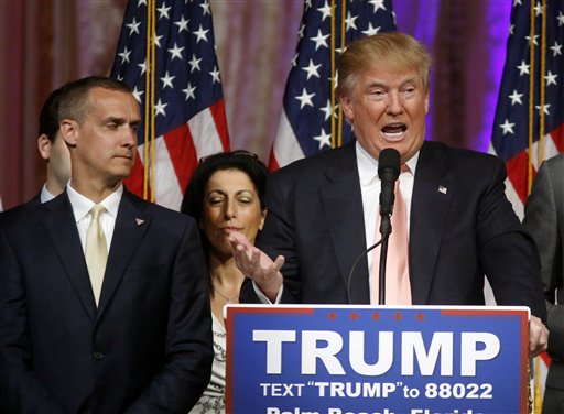 Republican presidential candidate Donald Trump speaks to supporters at his primary election night event at his Mar-a-Lago Club in Palm Beach, Fla., Tuesday, March 15, 2016. At left is his campaign manager Corey Lewandowski. (AP Photo/Gerald Herbert)