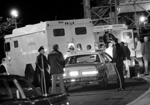 In this Oct. 21, 1981, file photo, police are at the scene of a Brinks armored truck robbery at the Nanuet Mall in Nanuet, N.Y., where multiple Nyack police officers and a Brinks guard were killed earlier during the robbery. After more than 30 years behind bars Mutulu Shakur, accused of running a revolutionary group that authorities said was responsible for a series of armed robberies, including the Brink's heist, may soon walk free. (AP Photo/File)