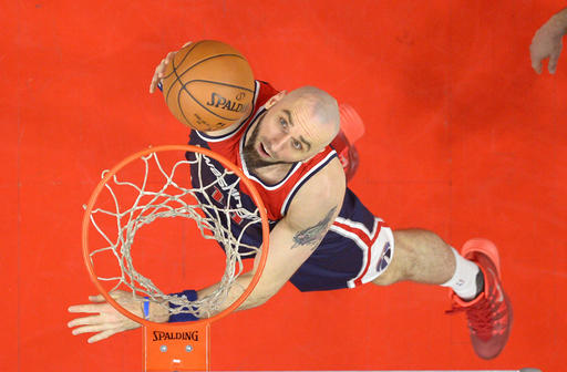 Washington Wizards center Marcin Gortat, of Poland, puts up a shot during the second half of an NBA basketball game against the Los Angeles Clippers, Sunday, April 3, 2016, in Los Angeles. The Clippers won 114-109. (AP Photo/Mark J. Terrill)