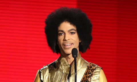 In this Nov. 22, 2015 file photo, Prince presents the award for favorite album - soul/R&B at the American Music Awards in Los Angeles. Authorities are investigating a death at Paisley Park, where pop superstar Prince has his recording studios. Jason Kamerud, Carver County chief sheriff's deputy, tells the Minneapolis Star Tribune that the investigation began on Thursday morning, April 21, 2016. (Photo by Matt Sayles/Invision/AP, File)
