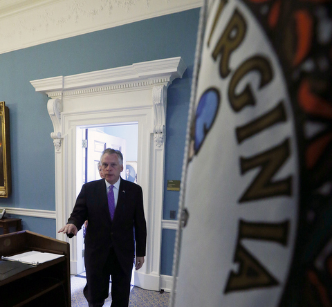 Virginia Gov. Terry McAuliffe arrives to a news conference to propose making significant changes to a bill that sought to allow the state to force condemned inmates to die in the electric chair when lethal injection drugs aren't available in Richmond, Va., Monday, April 11, 2016. The Democratic governor's amendment to the bill would give the state to power to compound lethal injection drugs needed for executions. (Bob Brown/Richmond Times-Dispatch via AP) MANDATORY CREDIT